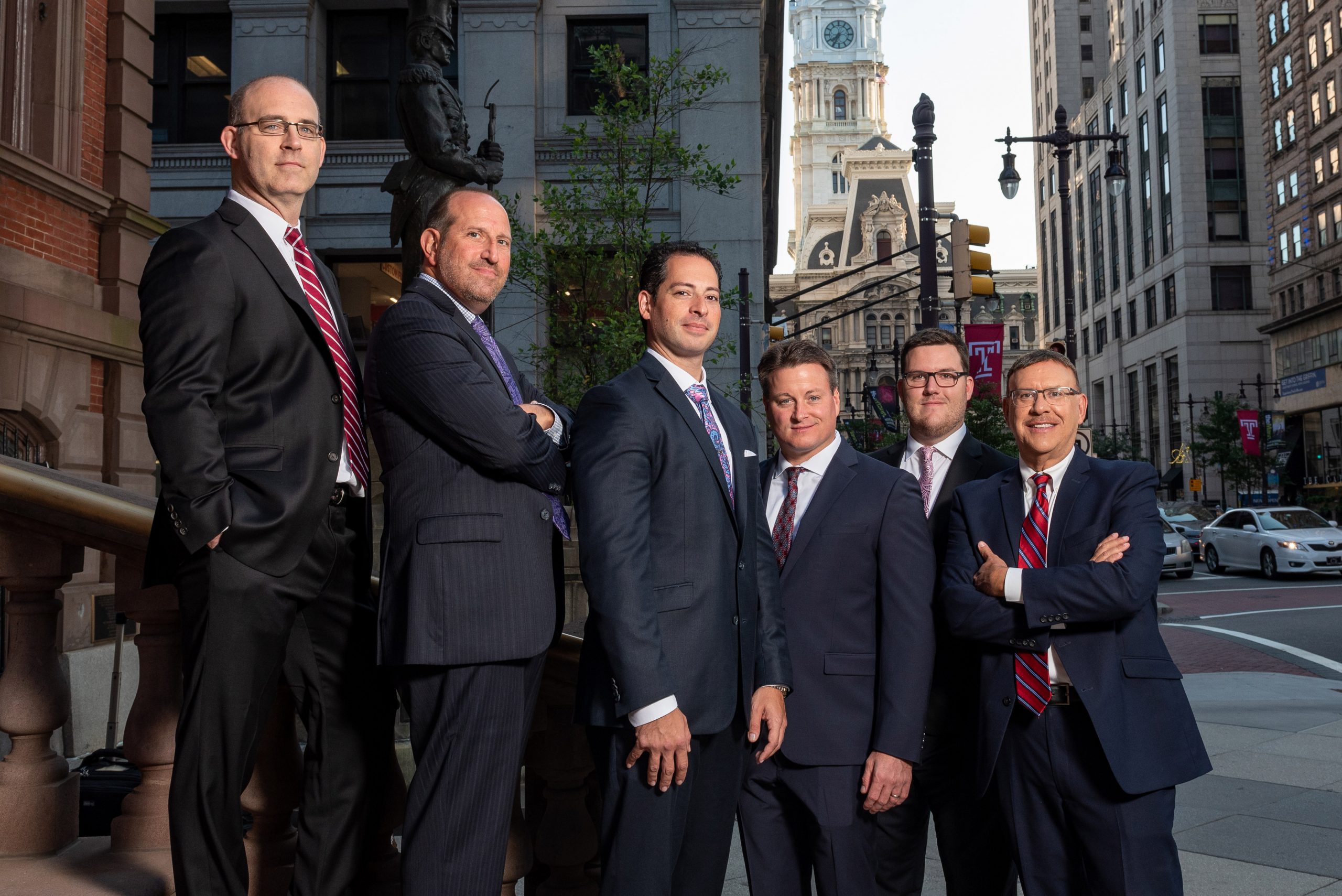 Spear Greenfield Personal Injury Attorneys legal team on outdoor steps in Philadelphia in front of City Hall