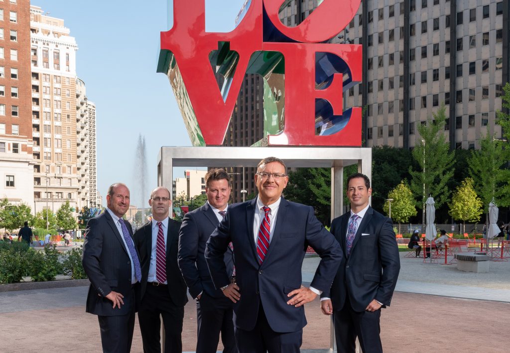 Spear Greenfield Car Accident Attorneys in front of Love Statue in Love Park in Philadelphia