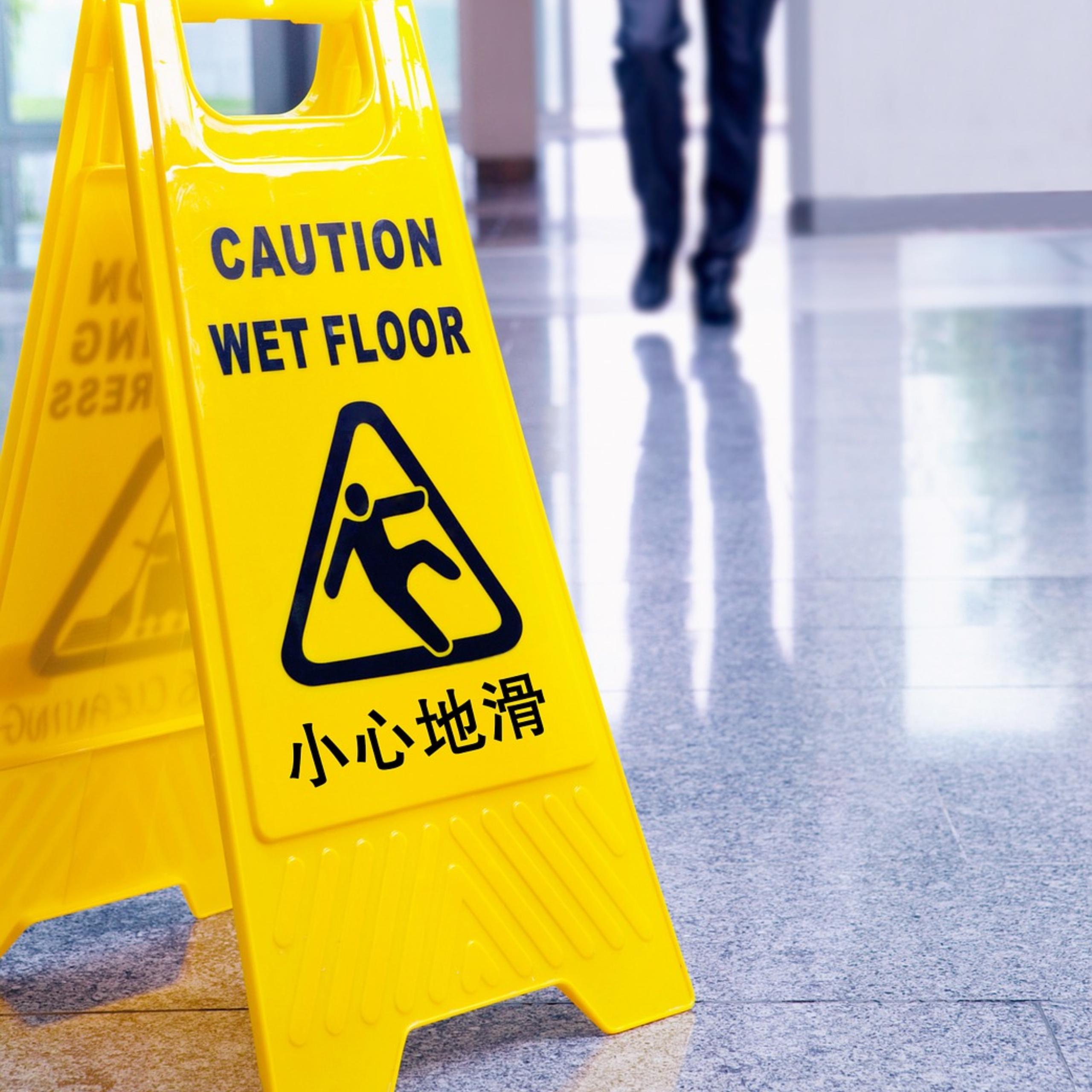 caution wet floor sign in commercial building