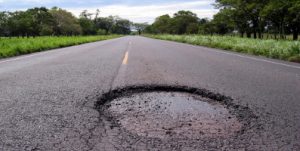 pothole in middle of rural road