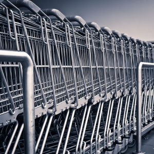 row of shopping carts outside big box retailer