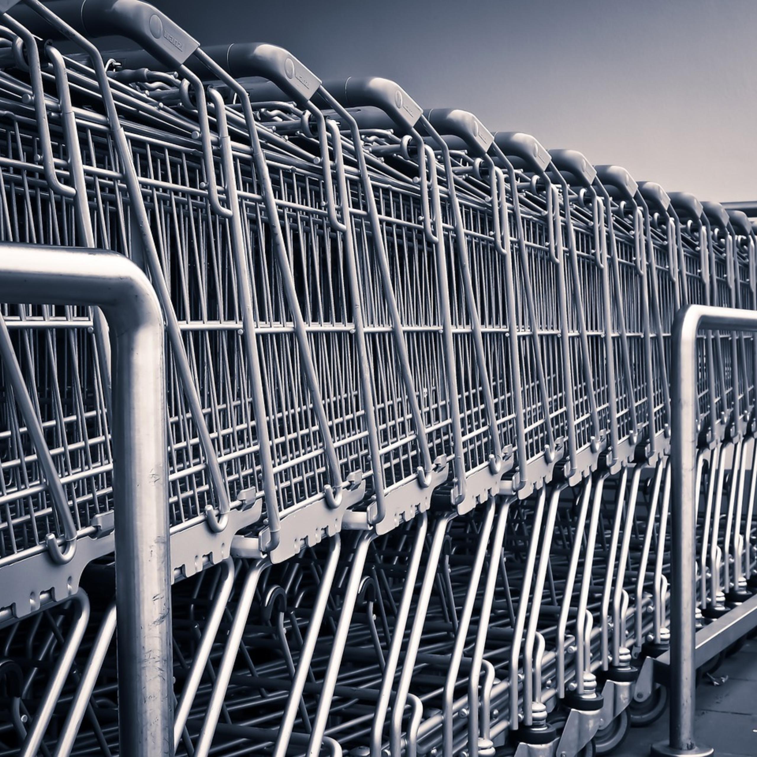 row of shopping carts outside big box retailer