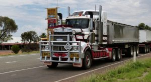 semi truck driving down road