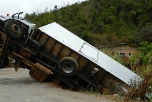 semi truck tipped over due to unsecured load