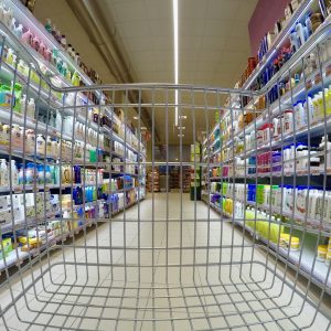 view of grocery store hair and body care aisle from shopping cart