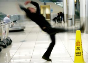 man slipping and falling on wet floor