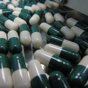 green and white pills