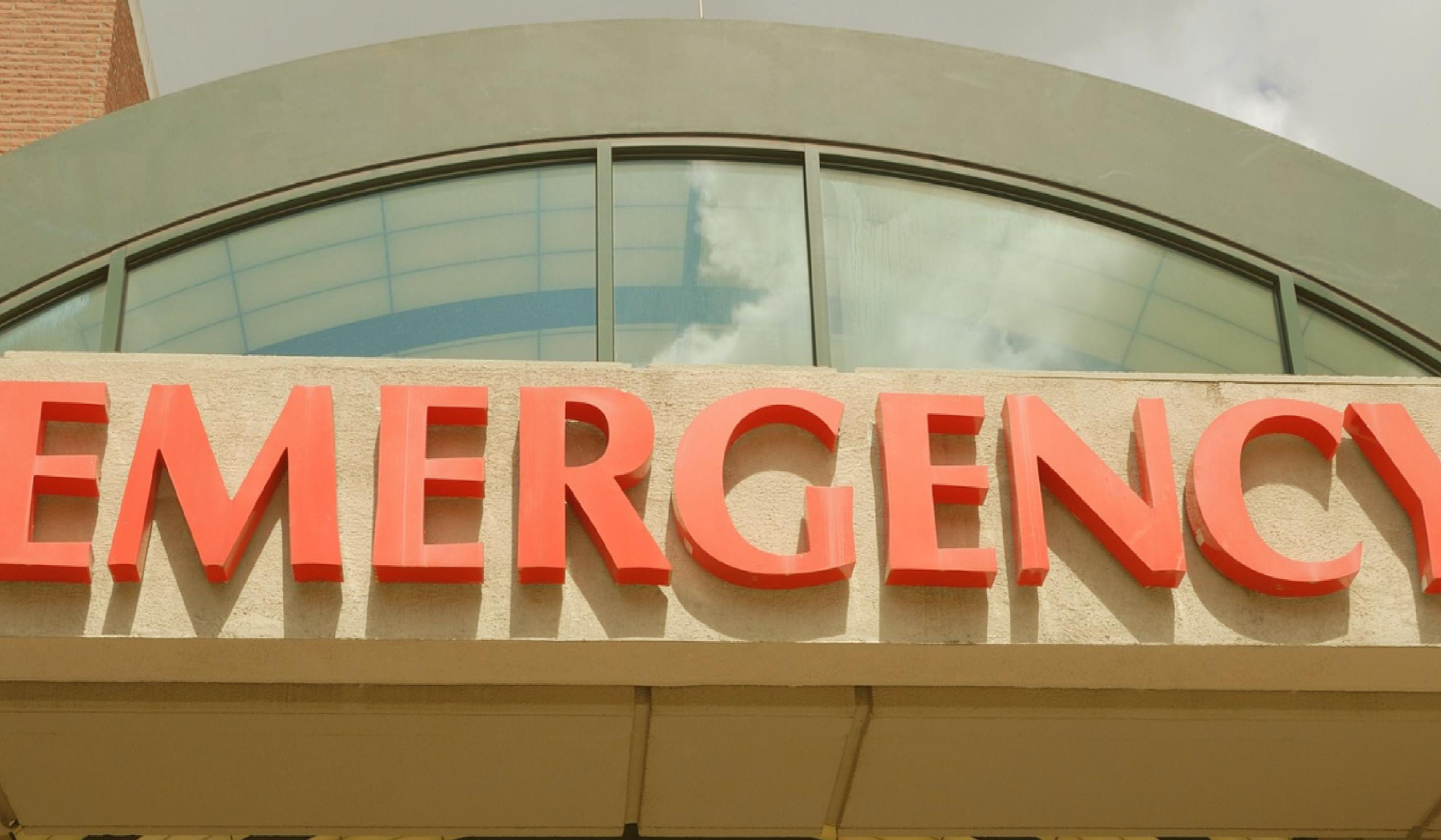 close up of hospital emergency room entrance sign