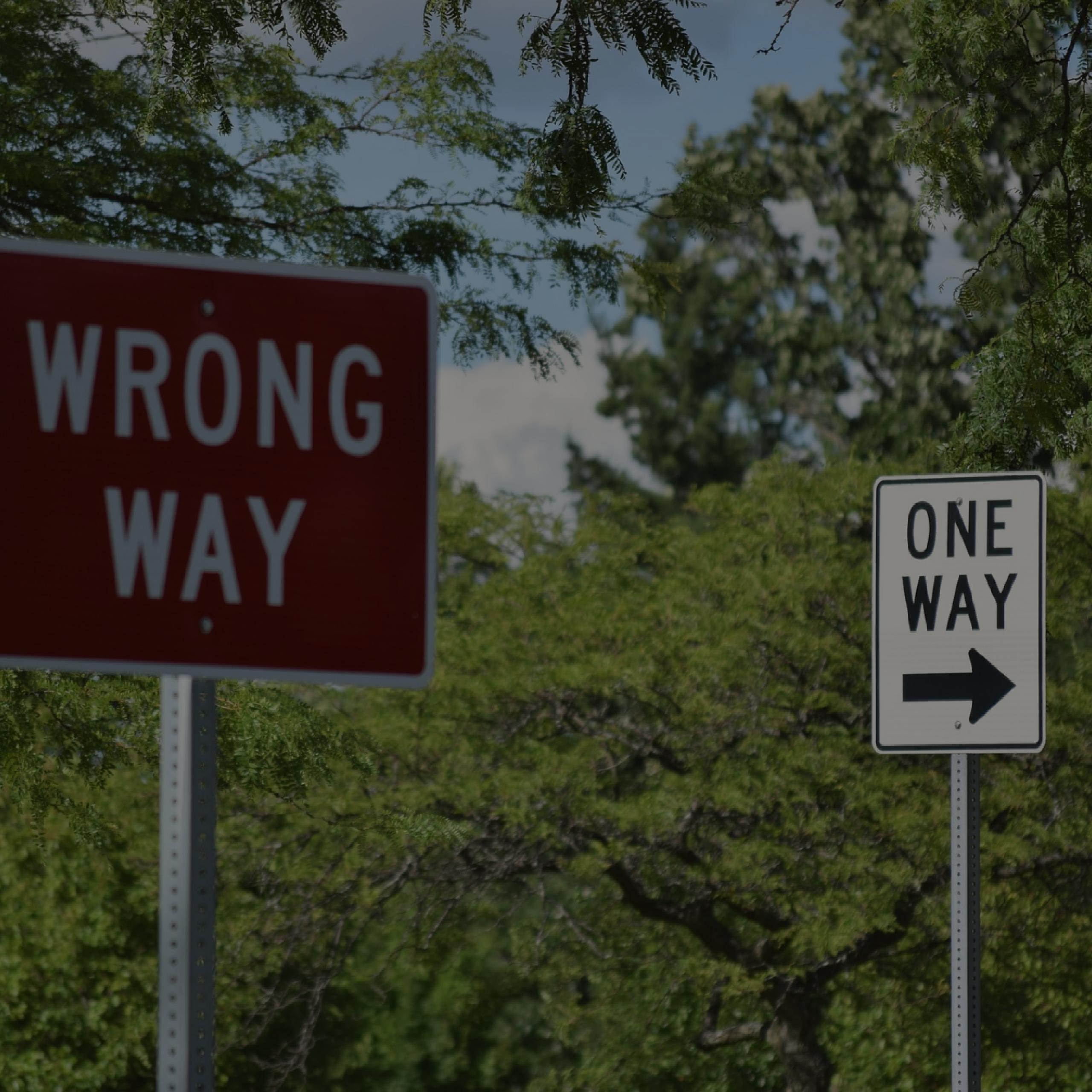 wrong way and one way signs