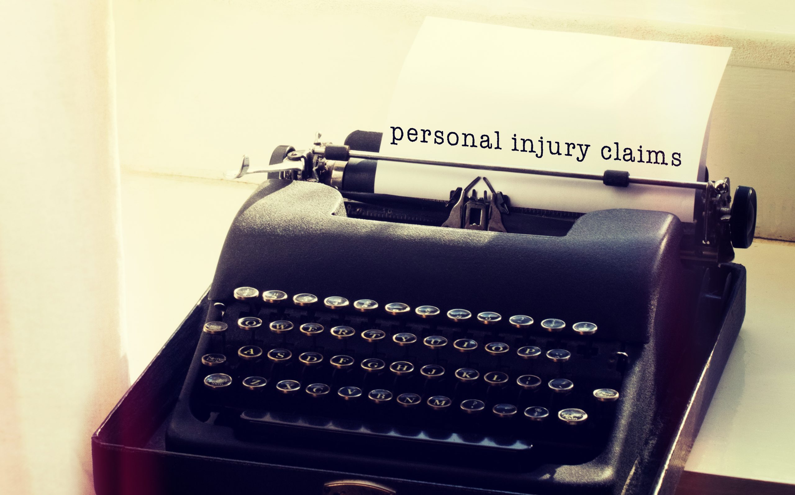 personal injury claims typed on old time typewriter