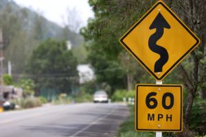 60 mph curved road sign