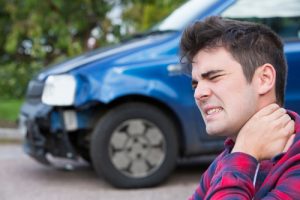 male with whiplash neck pain after car accident