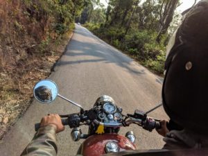 motorcycle driver's view of driving on rural road