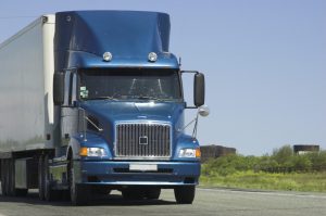 long haul semi truck driving on road