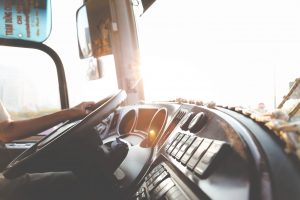 bus driver hands on steering wheel