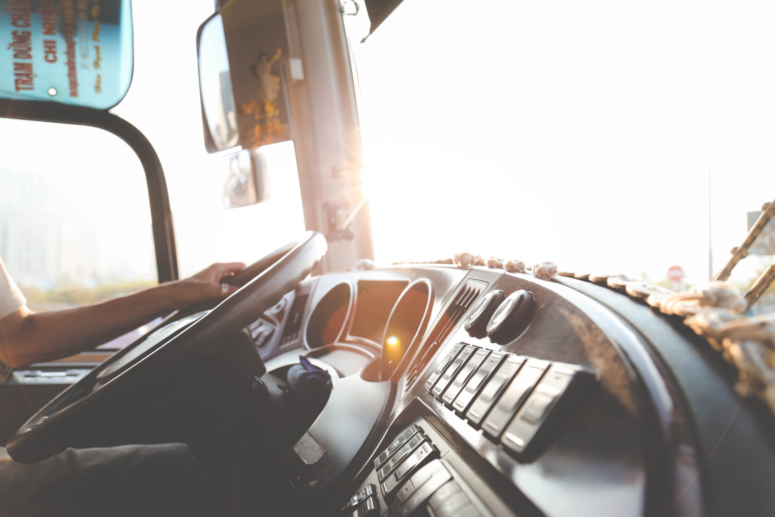bus driver hands on steering wheel