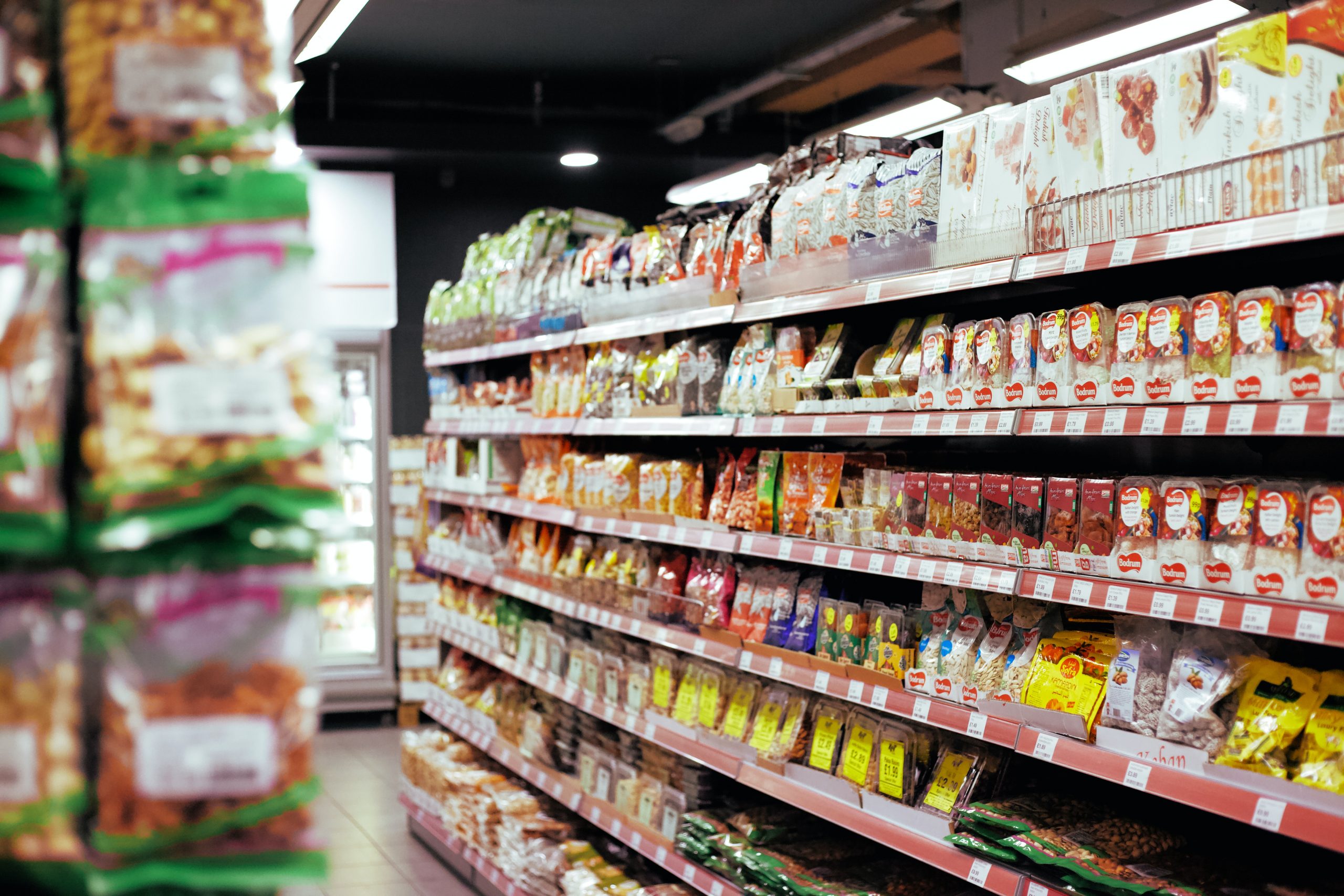 close up of food shelves in supermarket aisle