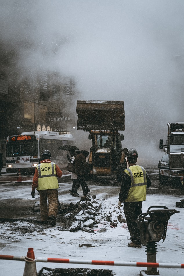 city clean up crew workers clearing snow and dirt in Philadelphia