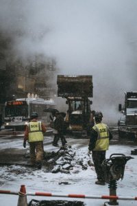 city workers cleaning up snow and debris in Philadelphia