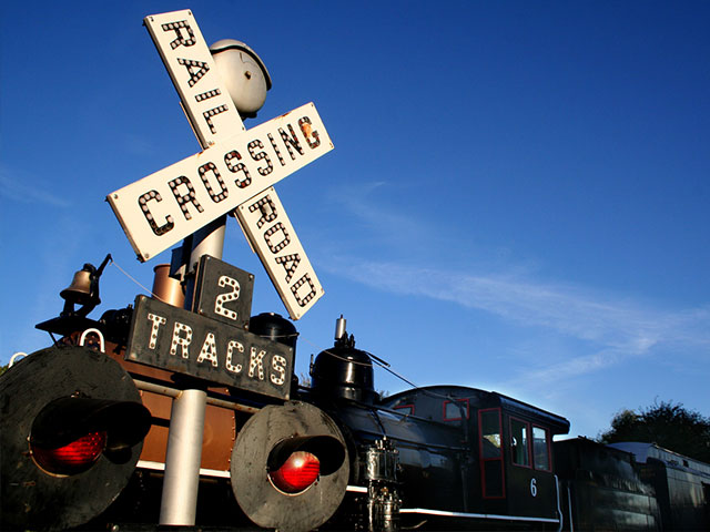 close up of train at railroad crossing