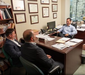 Spear Greenfield Attorneys Jeremy, Scott and Marc in meeting in offices