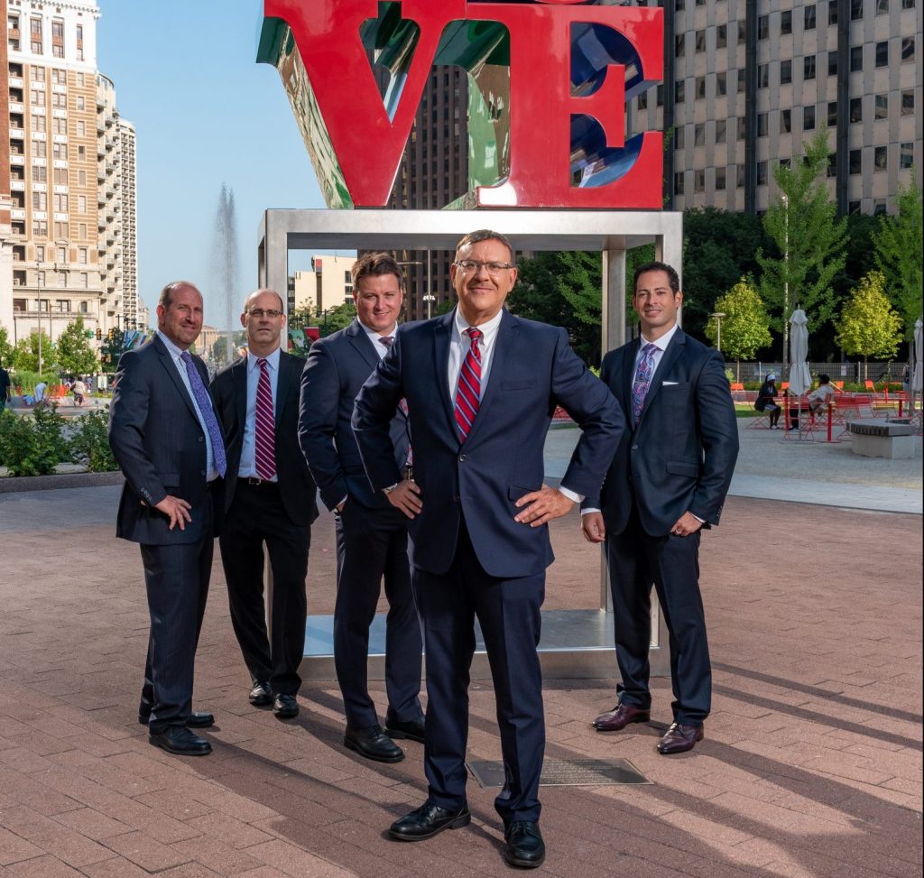 Spear Greenfield Personal Injury Attorneys legal team in front of Love Statue in Philly's Love Park