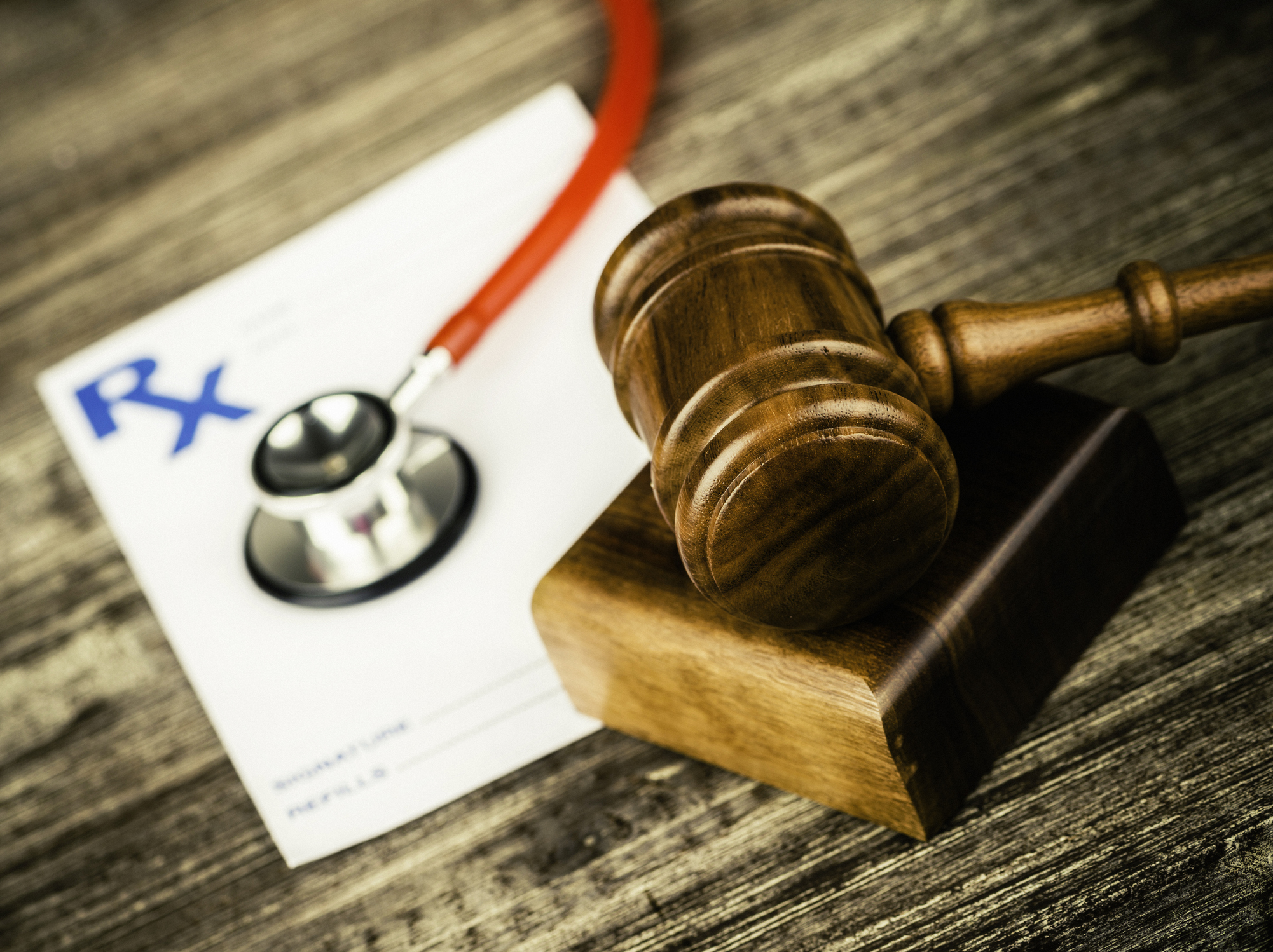 Prescription form with stethoscope and gavel. Medical Malpractice.