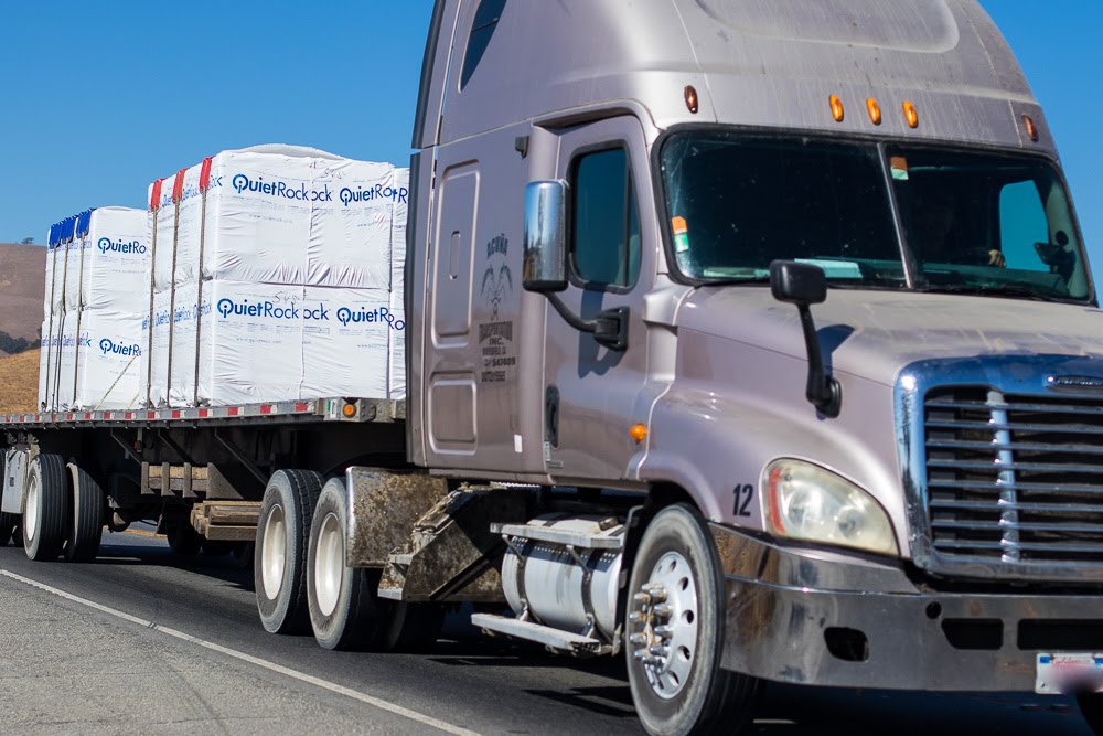 flat bed tractor trailer truck with load