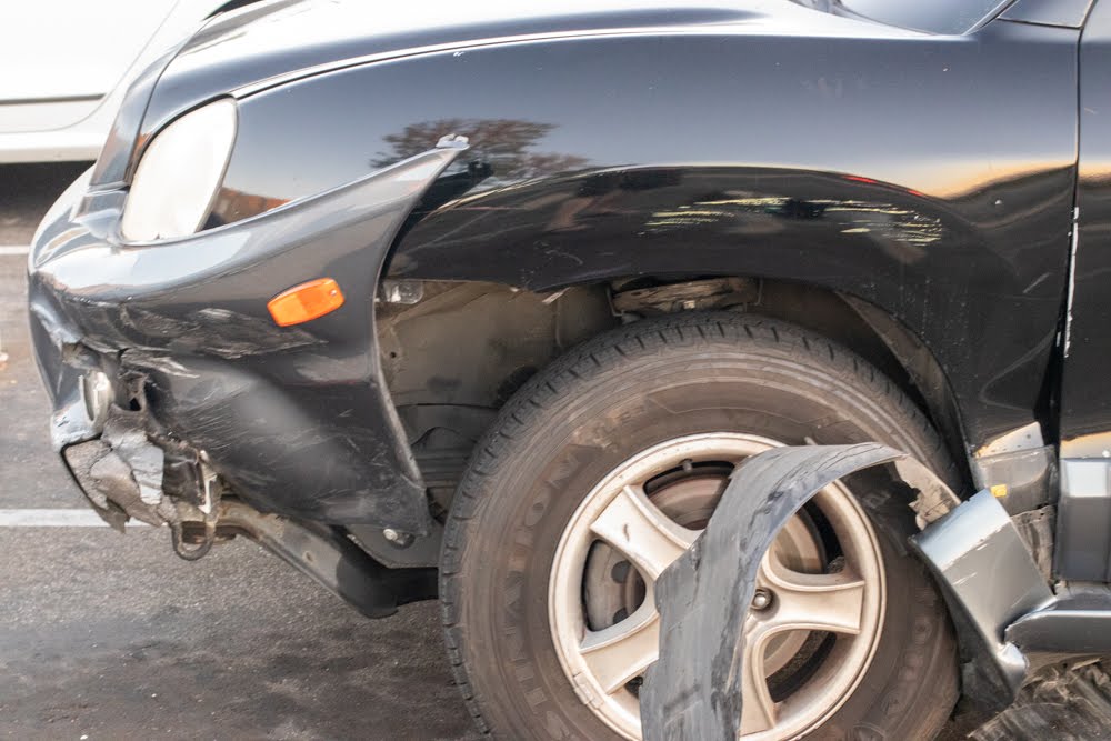 car with missing fender after an auto accident