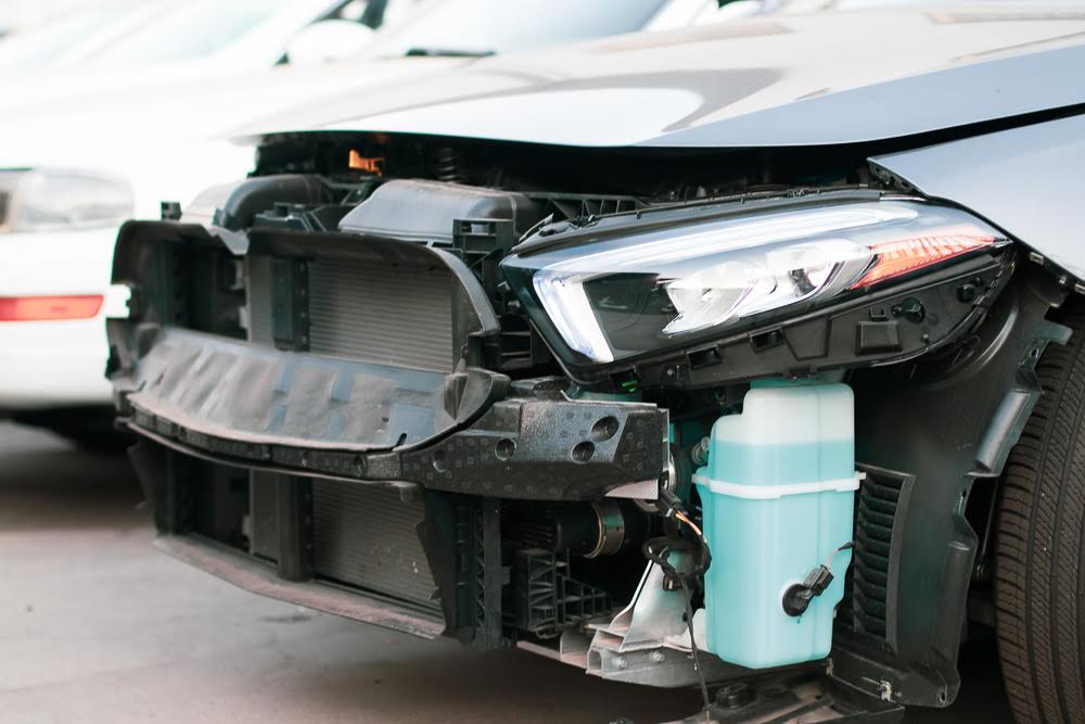 car with no fender after head on collision