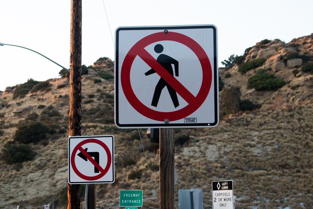 no pedestrians, no left turn signs