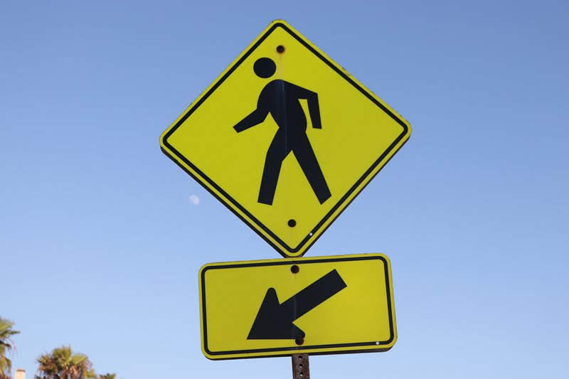 cross here crosswalk sign