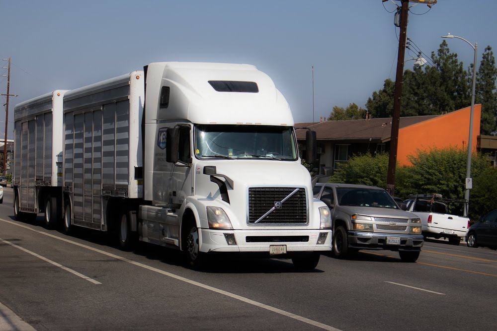 tractor trailer driving on highway