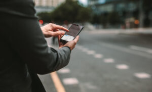 man ordering a rideshare ride