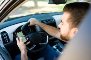 rideshare-driver-checking-app-while-driving