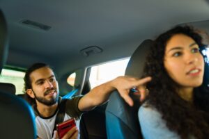 passenger telling rideshare driver where to go