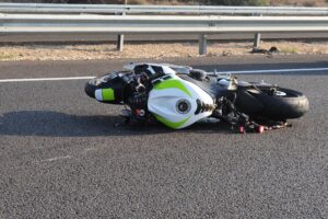 Motorcyclist Trapped Under Vehicle in Crash at Park Ave & S Main St