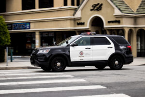 Vehicle Reverses, Hits Officer Near 19th St